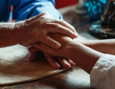 Compassionate hands conveying empathy in assisted dying debate – UK context