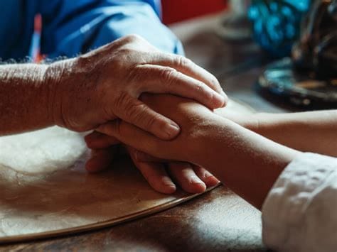 Compassionate hands conveying empathy in assisted dying debate – UK context
